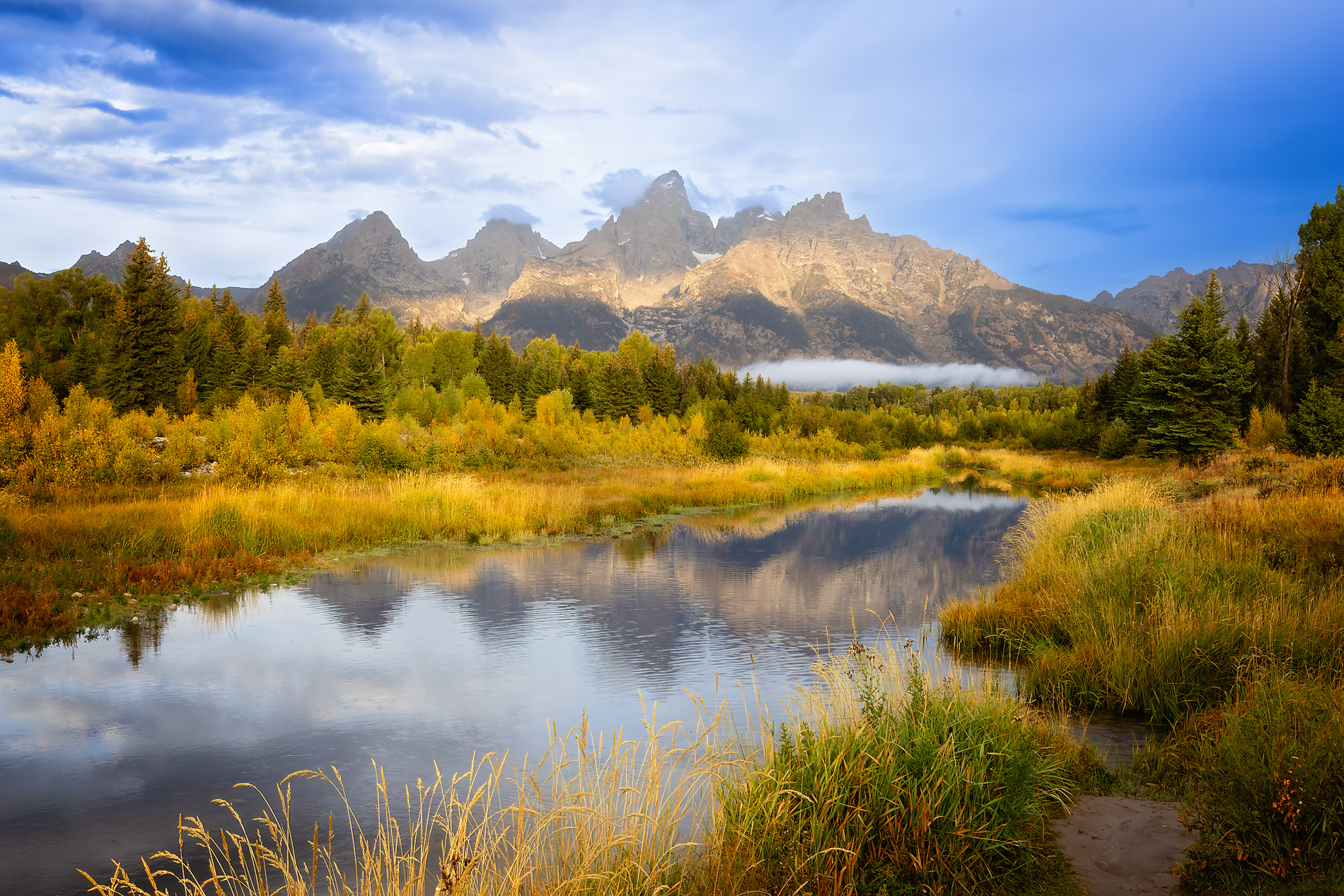 Iconic Grand Teton landscape reflected in calm water